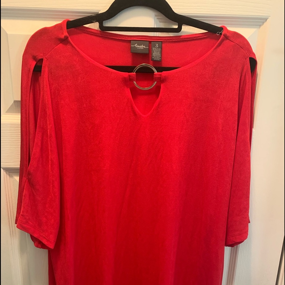 Adorable red cold shoulder shirt .